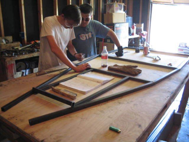 That's my dad on the left, little bro on the right.  Laying out the lower rails.
